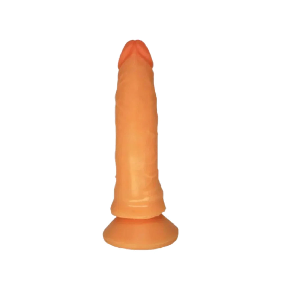 Orange silicone dildo on a white background