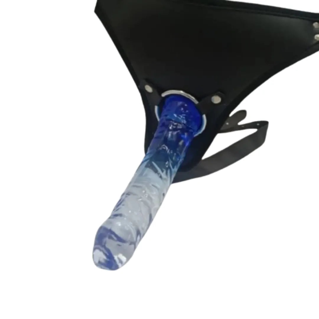 Blue and clear dildo attached to a black strap on a white background