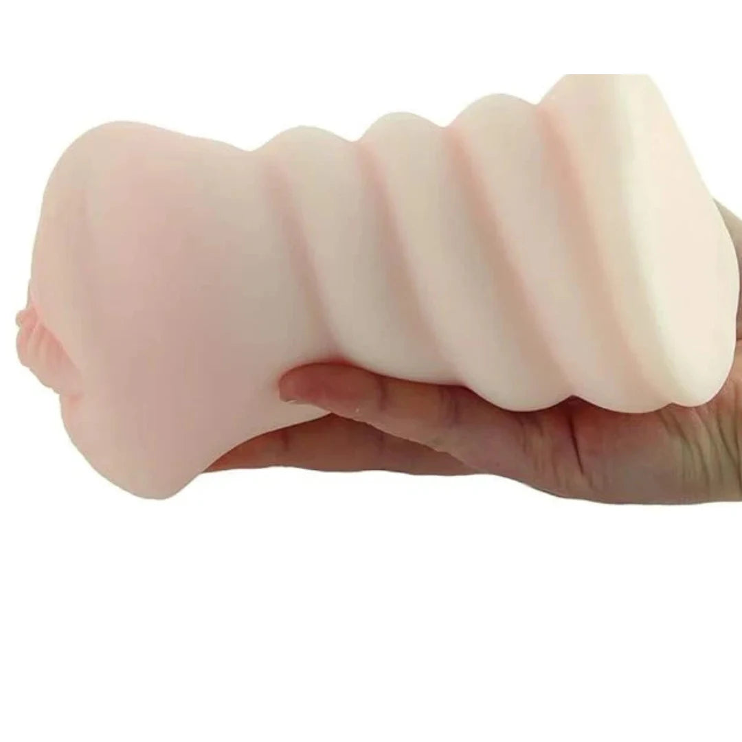 Hand holding a silicone male masturbator on a white background