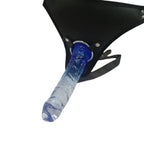 Blue and clear dildo attached to a black strap on a white background