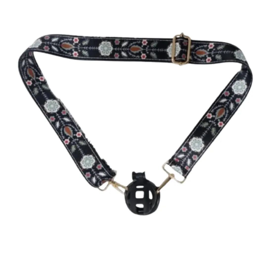 Floral-patterned belt with black plastic chastity cage on a white background