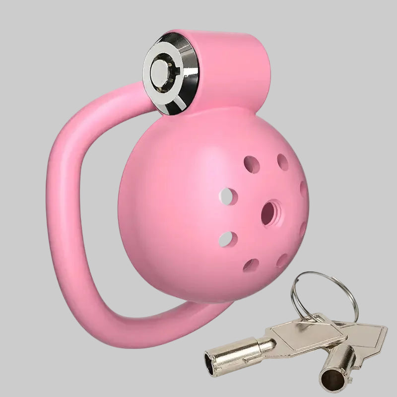 Pink ball with a handle and keychain on a white background