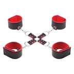 Black and red leather cuffs with a central chain on a white background