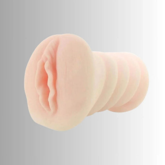 Close-up of a silicone male masturbator on a gray background