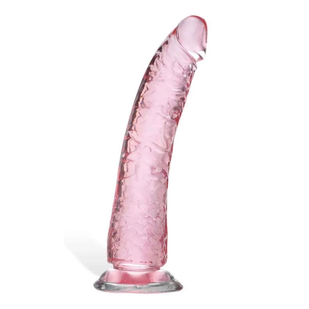 Pink textured dildo on a white background