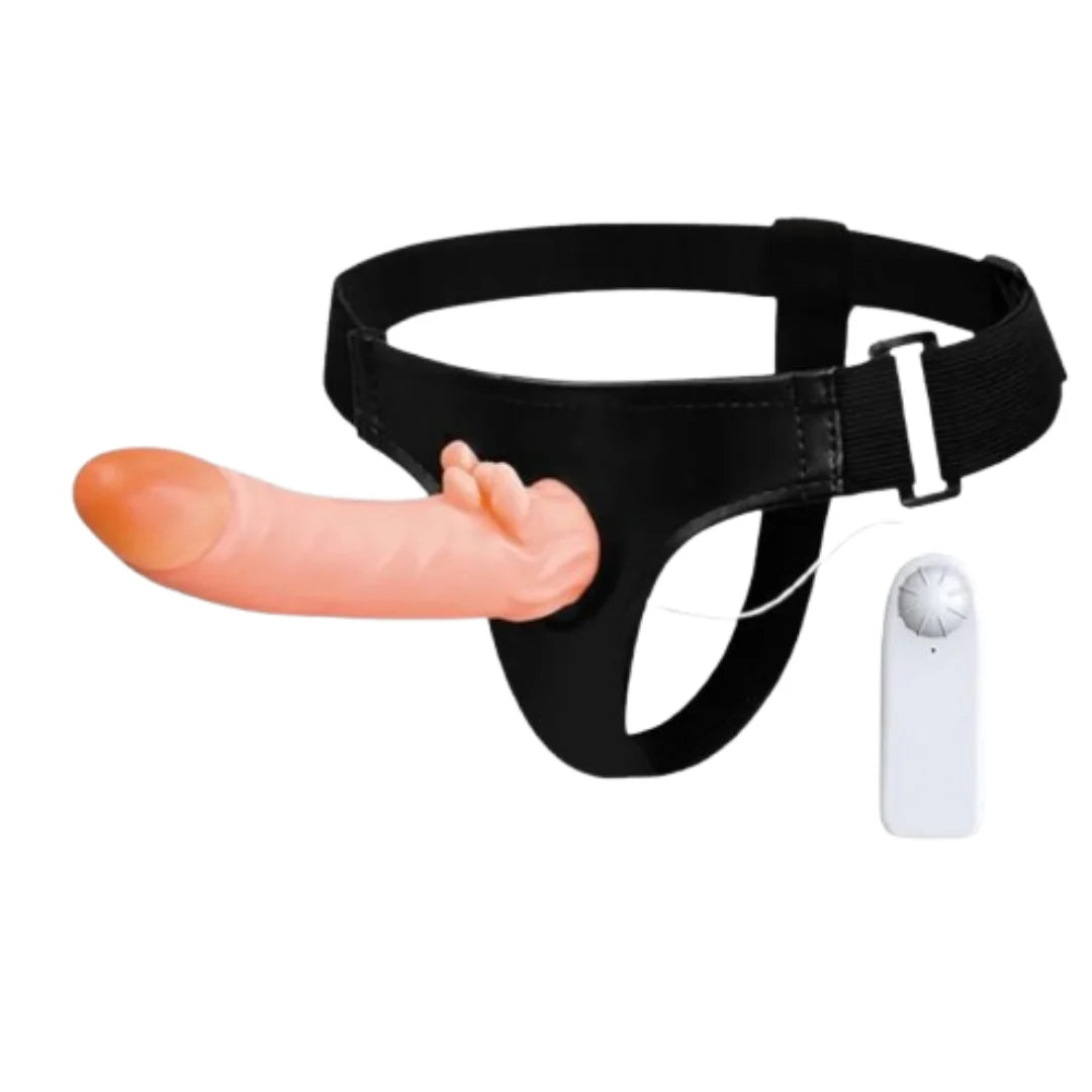 Black harness with pink dildo and a remote control on a white background