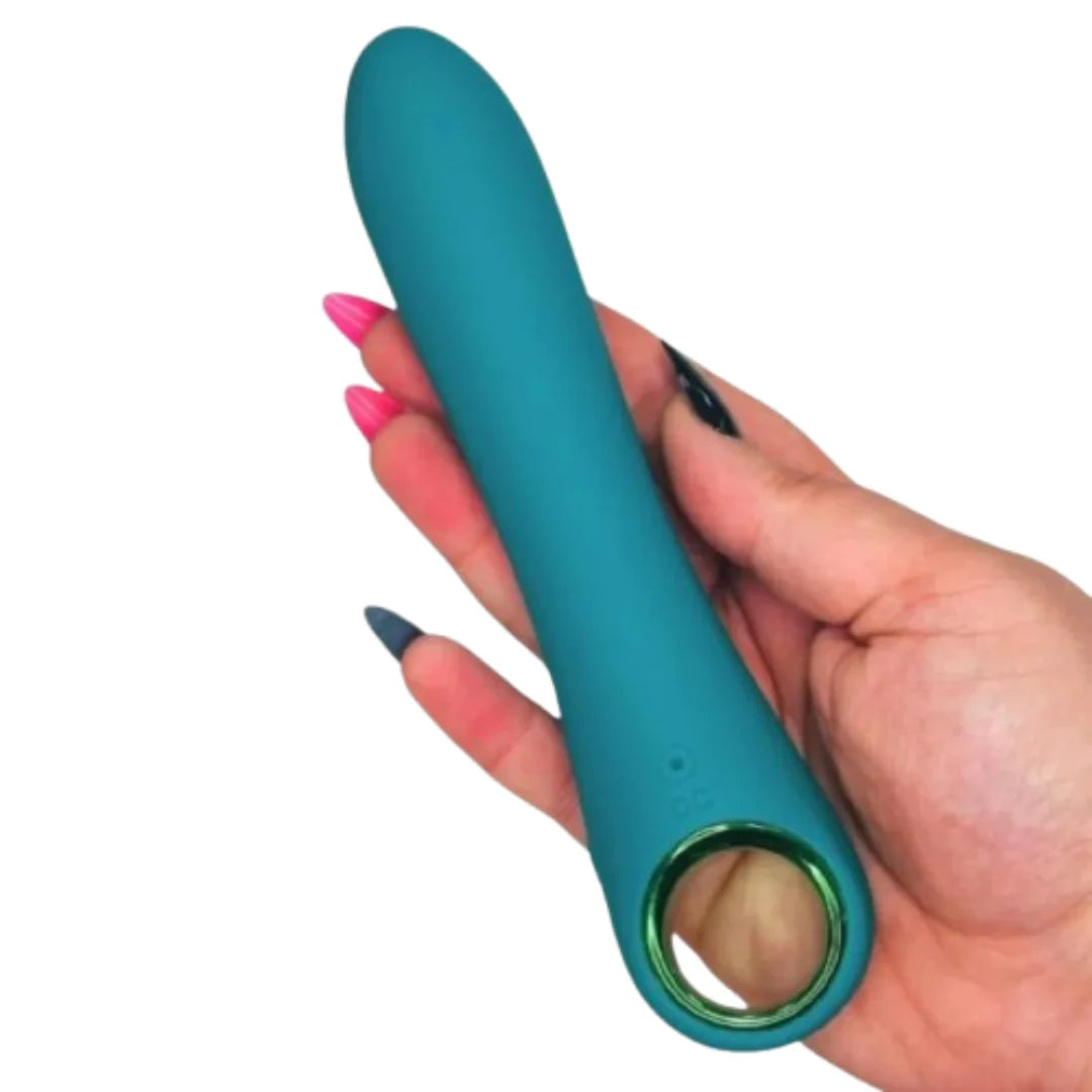 Teal silicone Vibrator  held in a hand with pink nail polish on a white background